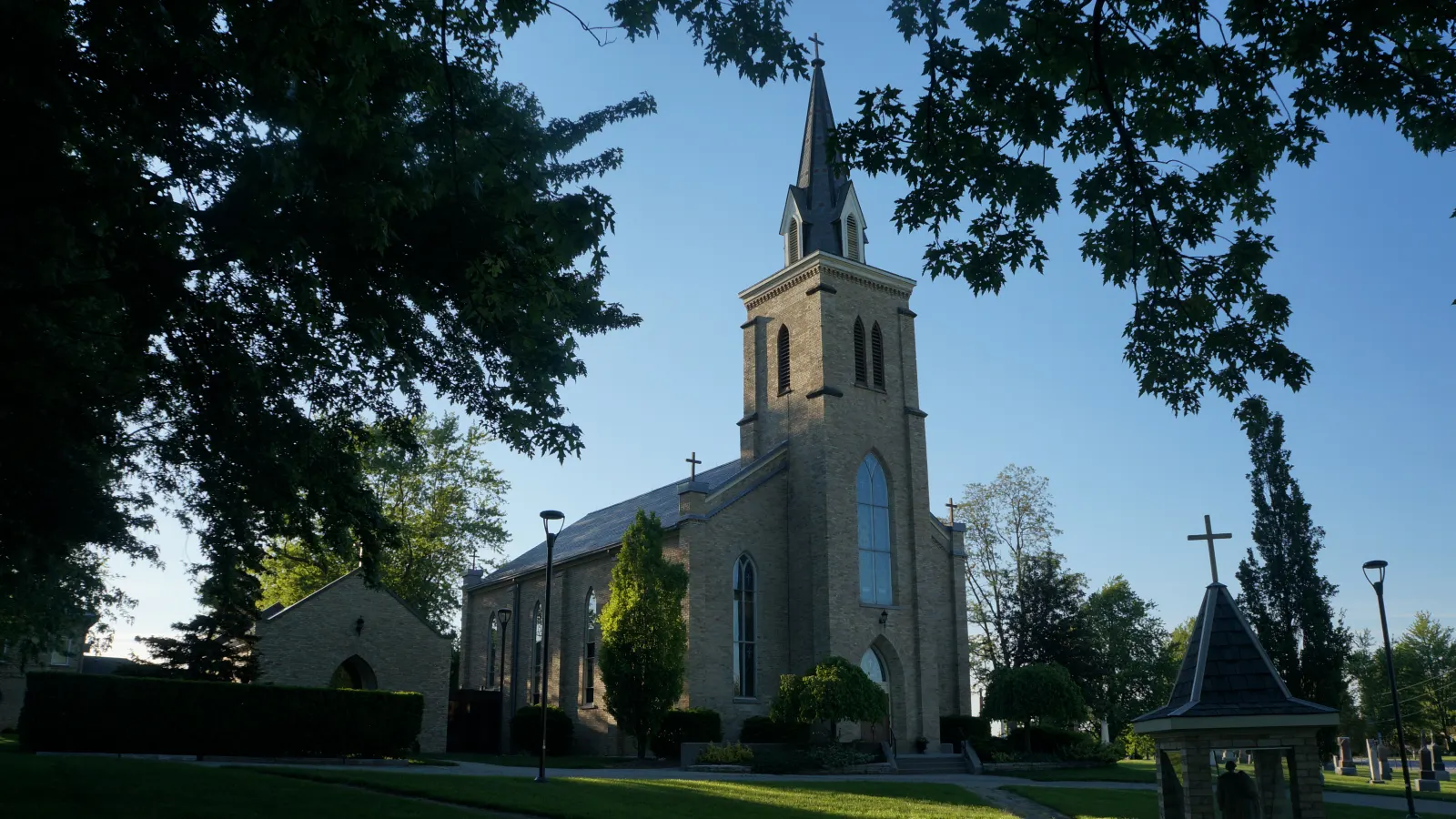 St. Patrick's Church in Lucan, a stone church with a tall spire, framed by trees