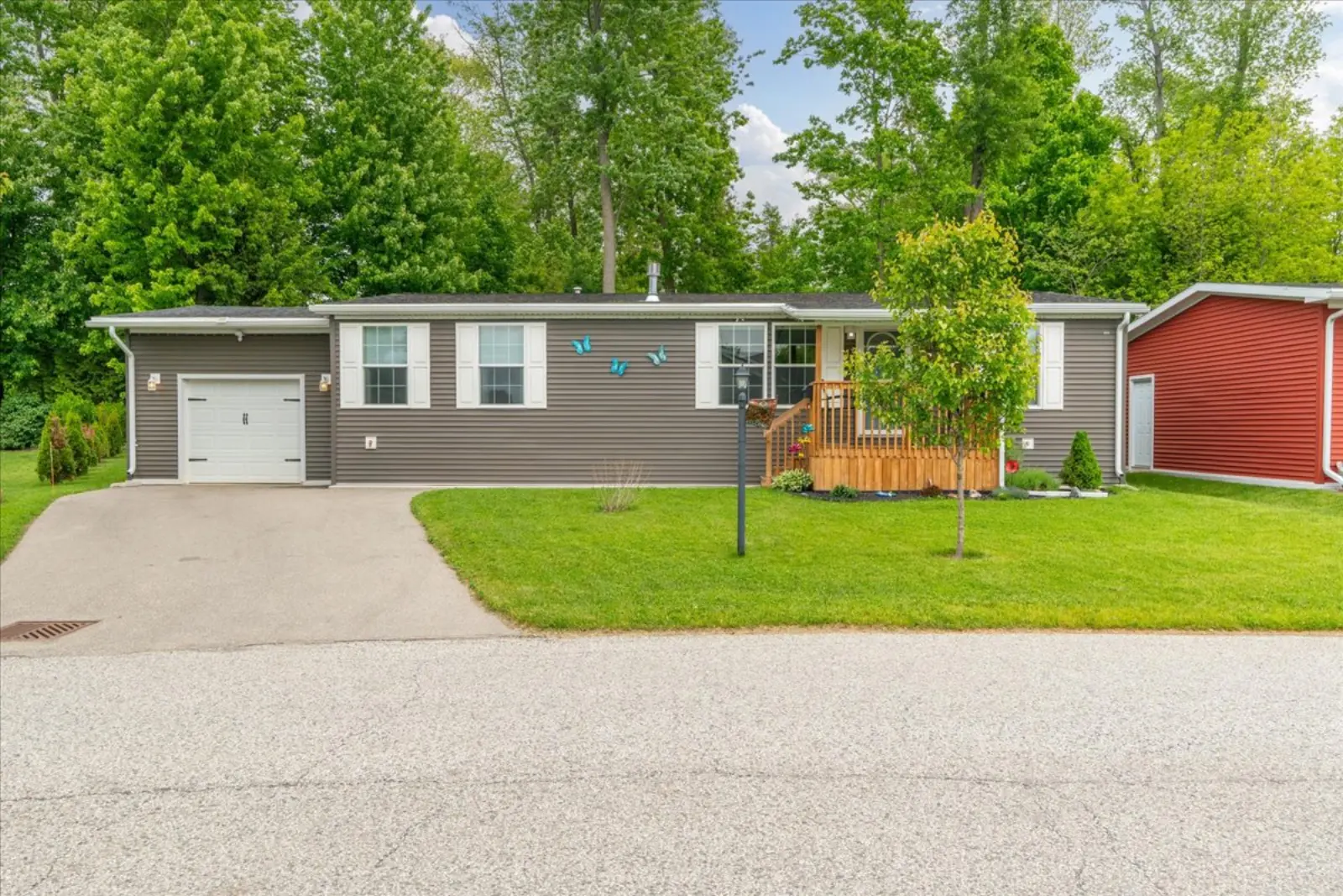 Front of the home with the garage and a covered porch