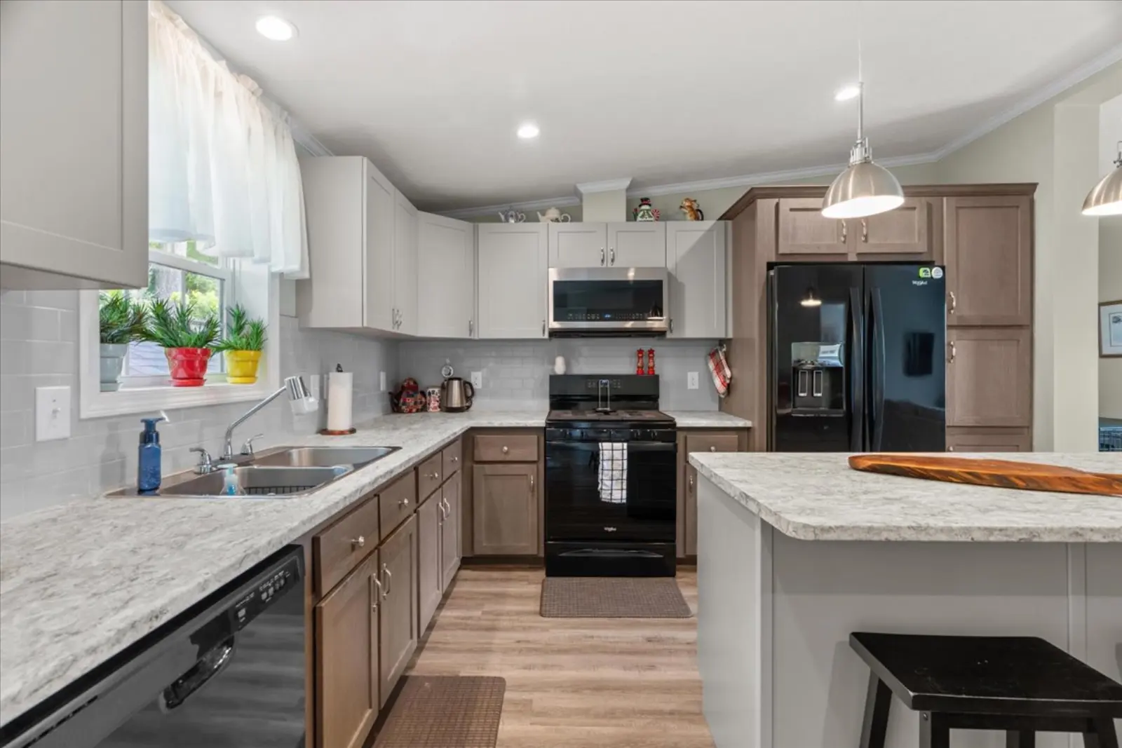 Kitchen with an island and black appliances