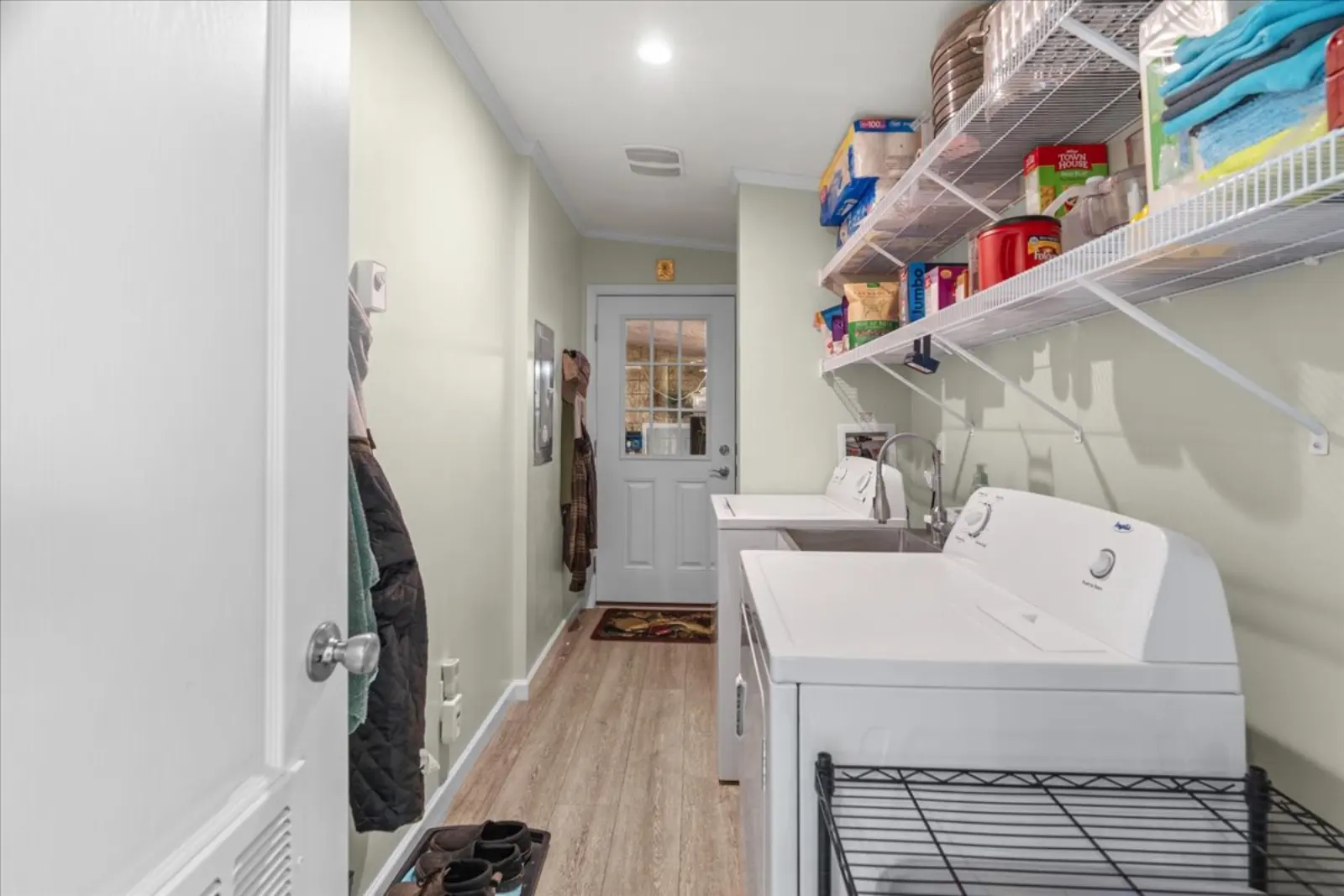 Laundry room with shelving