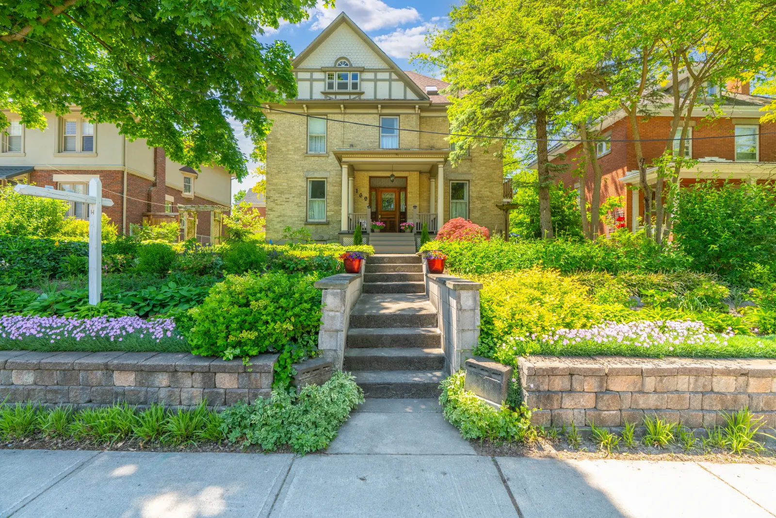 Front steps rising through terraced gardens to the house