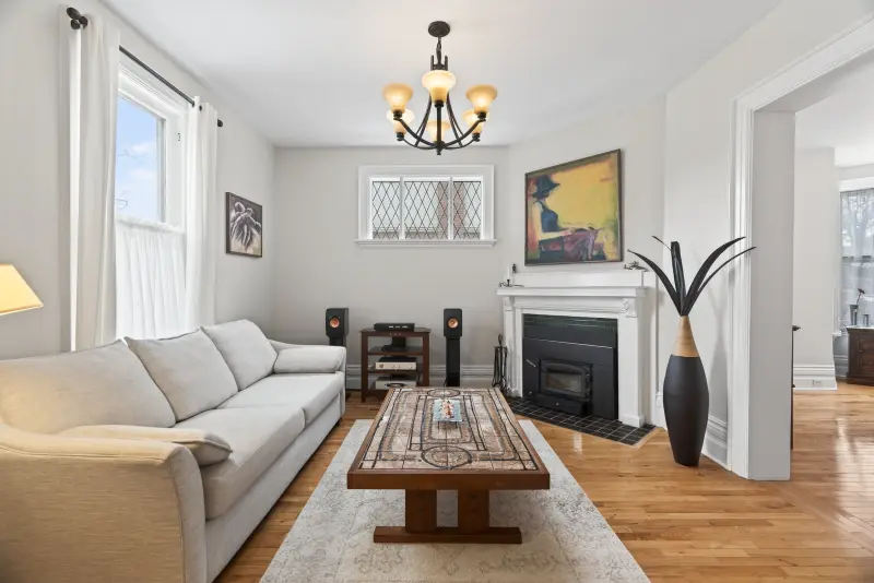 Living room with a fireplace and hardwood floors