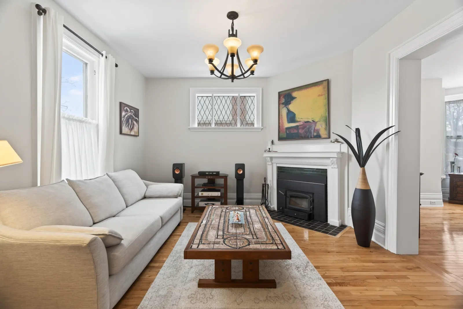 Living room with a fireplace and hardwood floors