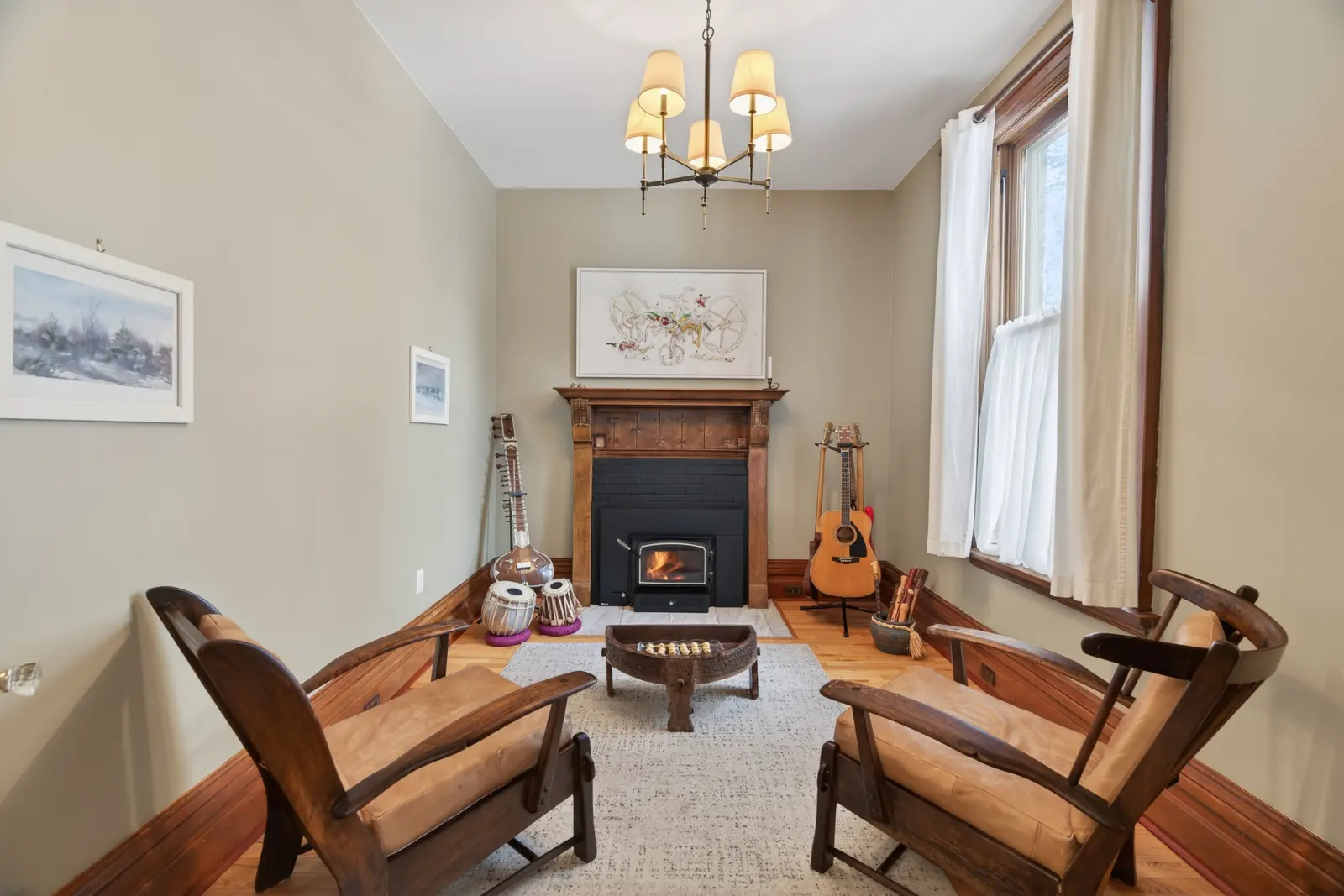 Sitting room with a wood-burning fireplace