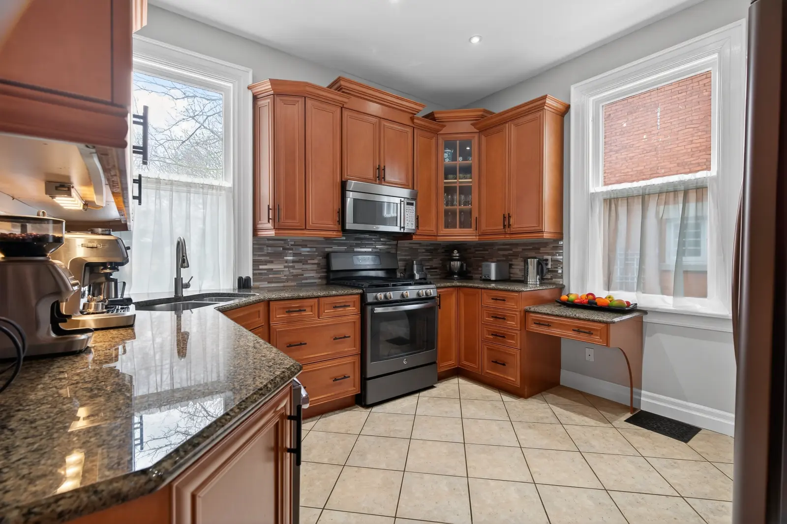Kitchen with wood cabinets and granite counters