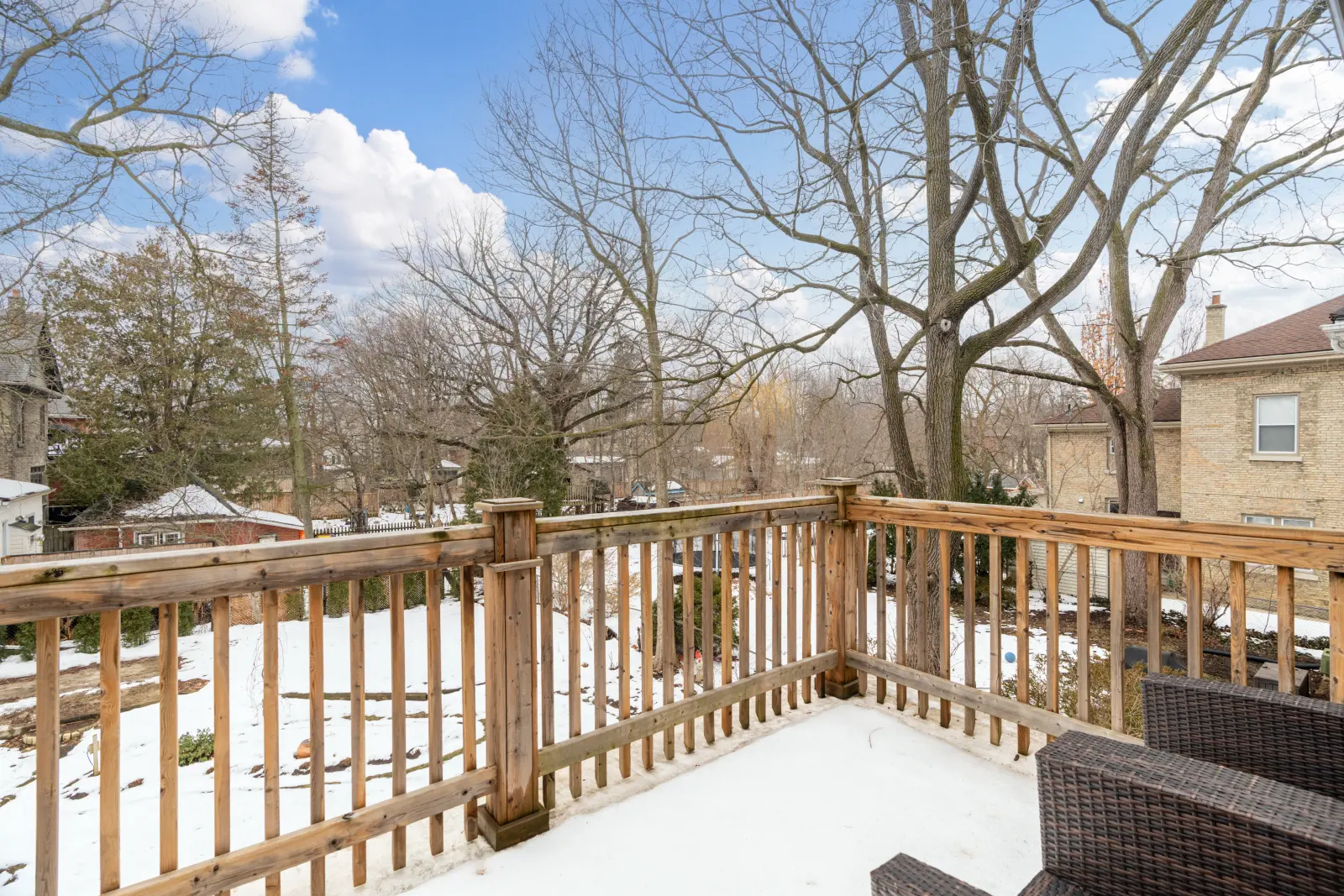 Wood deck looking out over the trees in winter