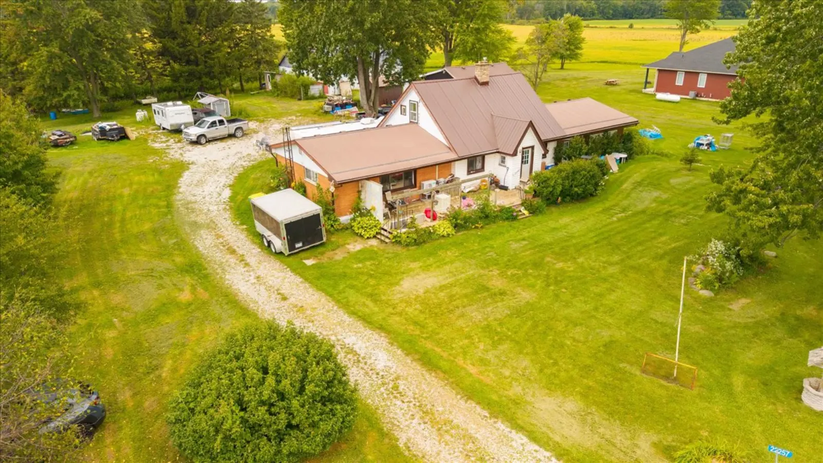 The house, driveway and trees from the air