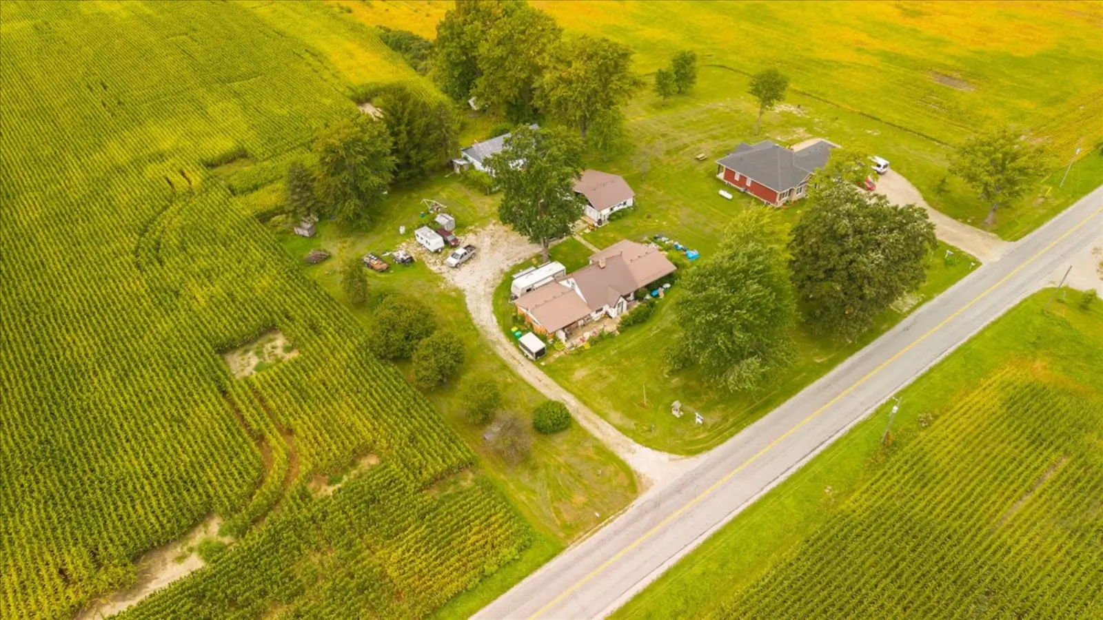 The property beside the road and fields