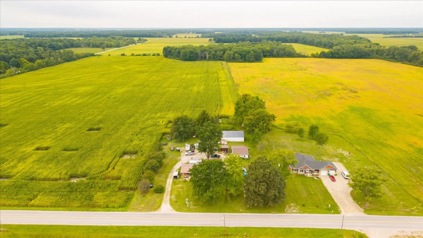 Wide view of the property and the farmland around it