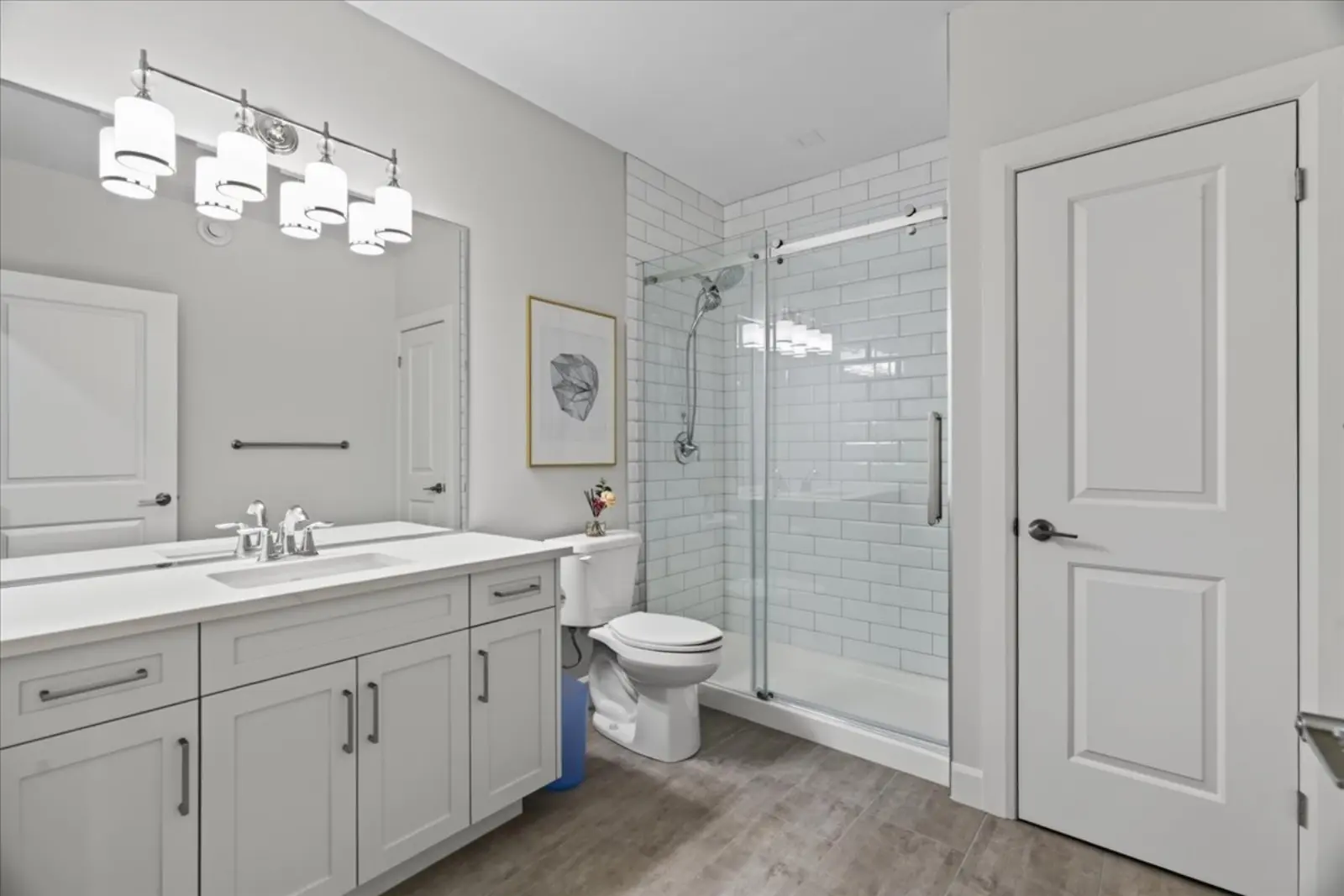 Lower-level bathroom with a glass shower