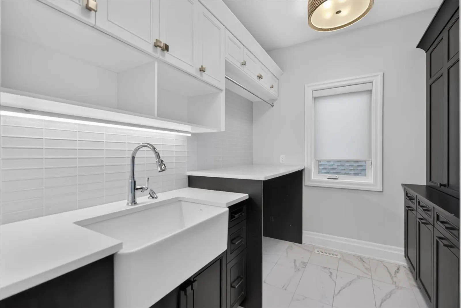 Laundry room with a farmhouse sink