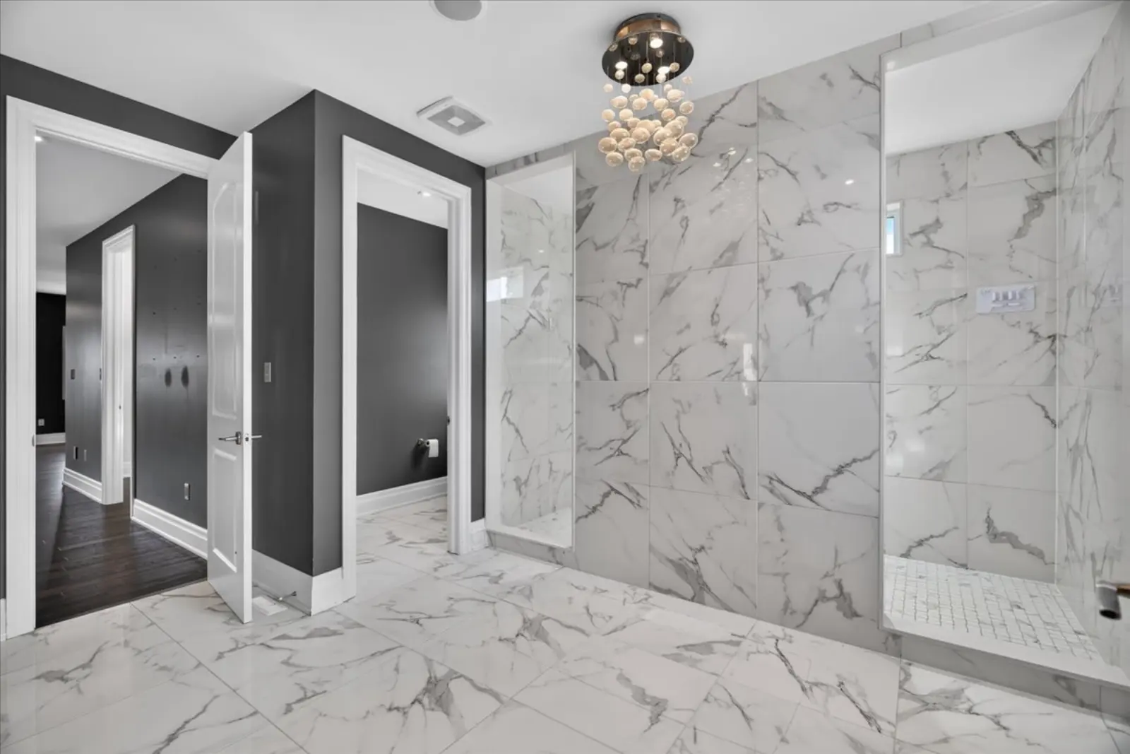 Primary ensuite with marble tile