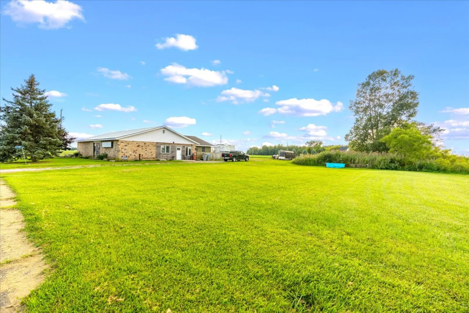 The open lawn with the building in the distance
