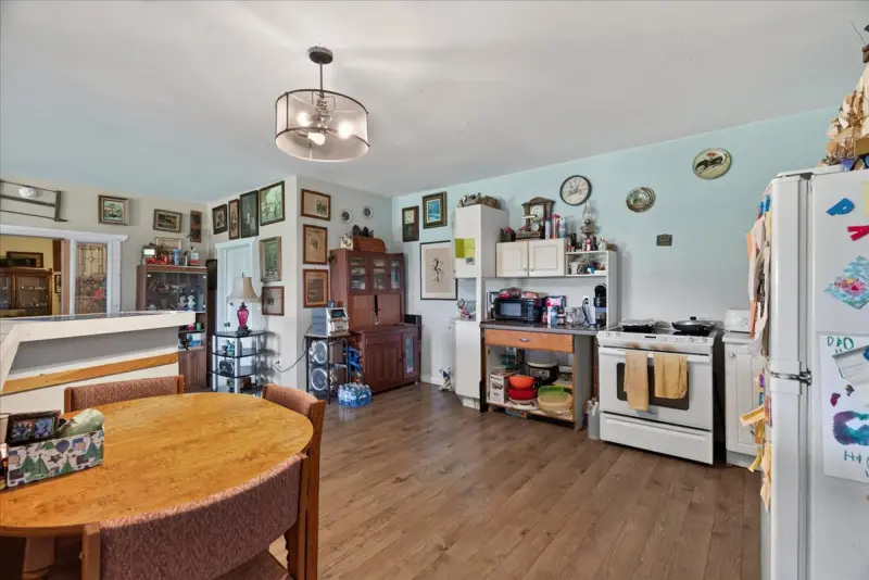 Kitchen with white cabinets and a round table