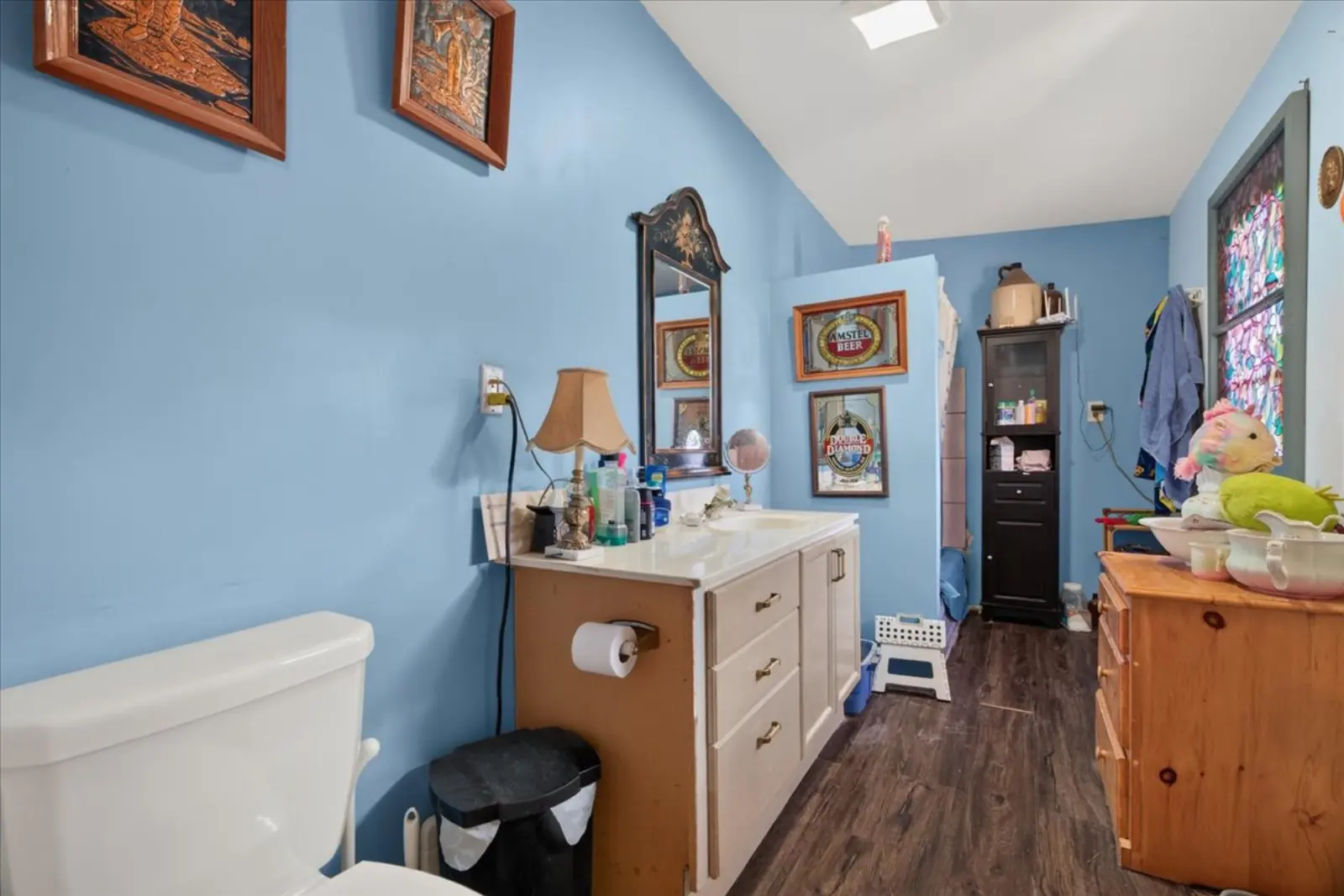 Bathroom with a vanity and blue walls