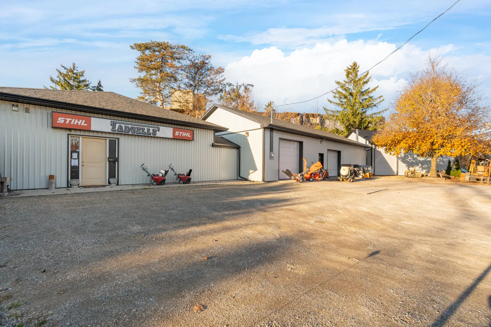 The buildings and gravel yard in the fall