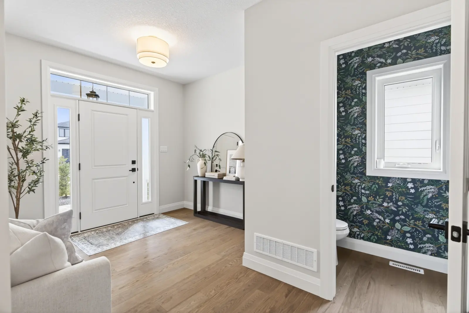 Model home: front foyer with a mirror and console