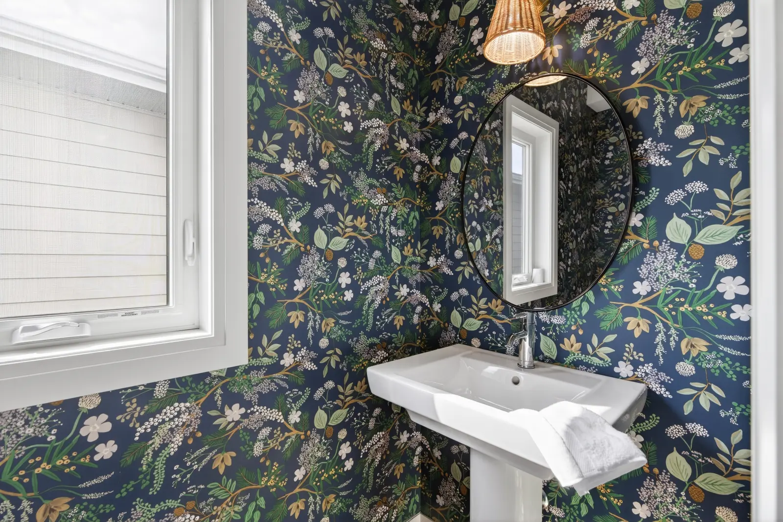 Model home: powder room with patterned wallpaper