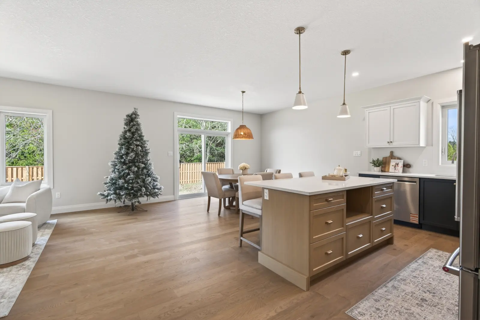 Model home: open main floor with the kitchen island and dining area