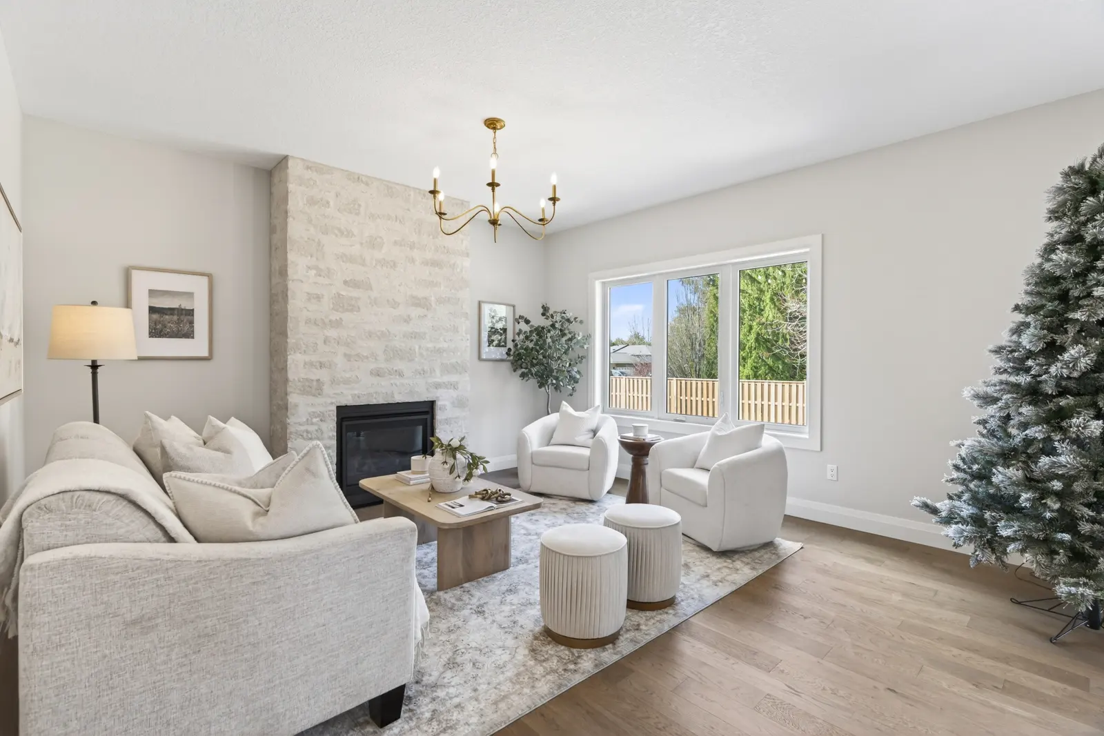 Model home: living room with a stone fireplace