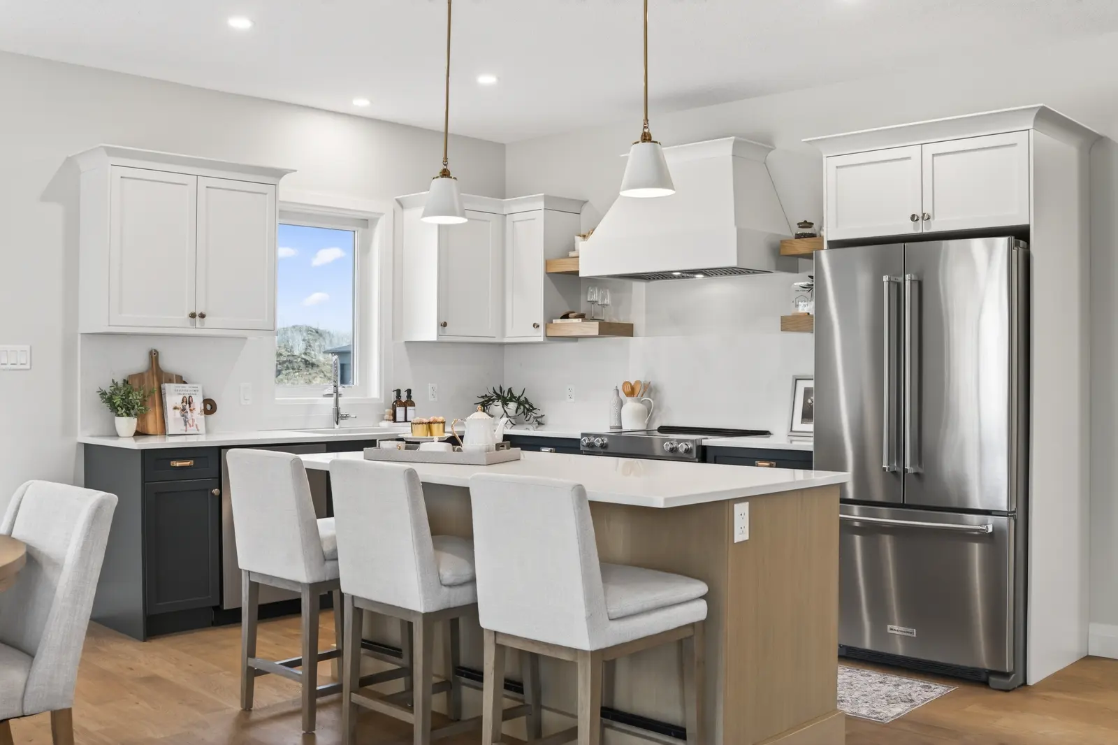 Model home: kitchen with a centre island and quartz counters