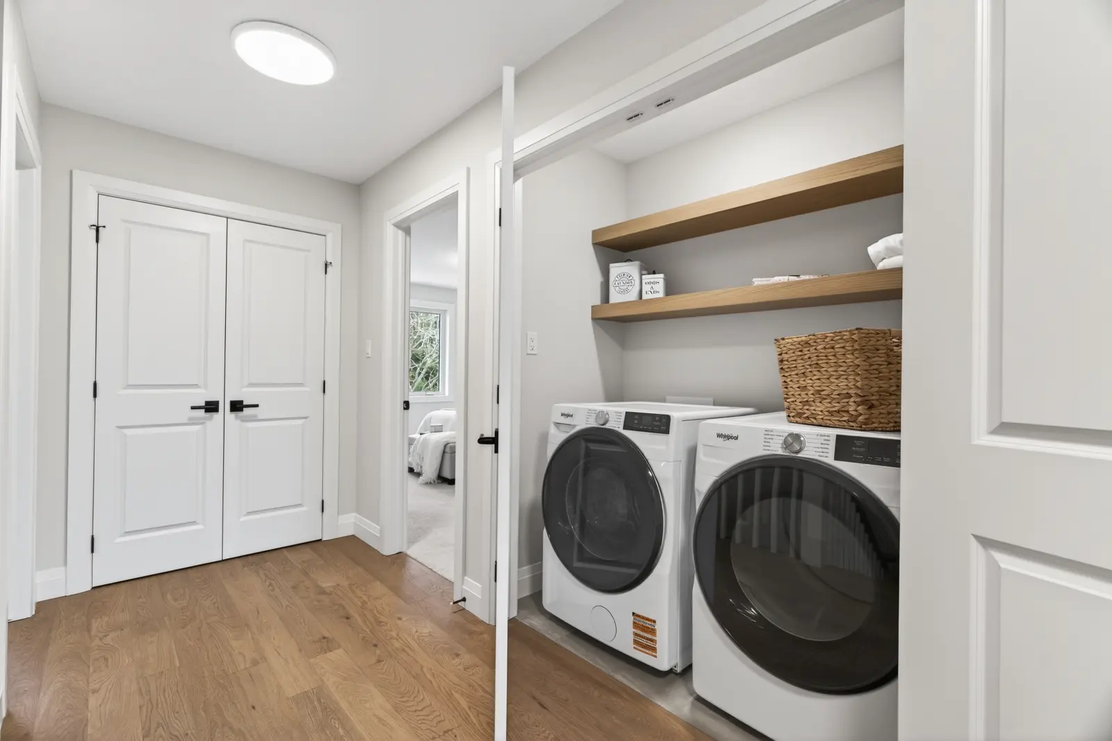 Model home: laundry room with floating shelves