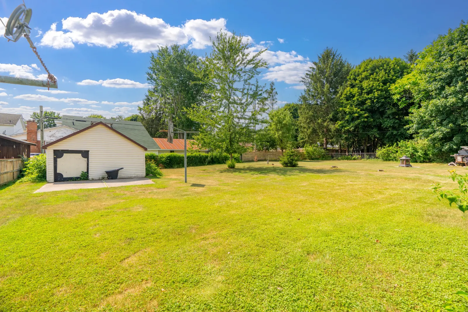 Deep backyard with the detached storage shed
