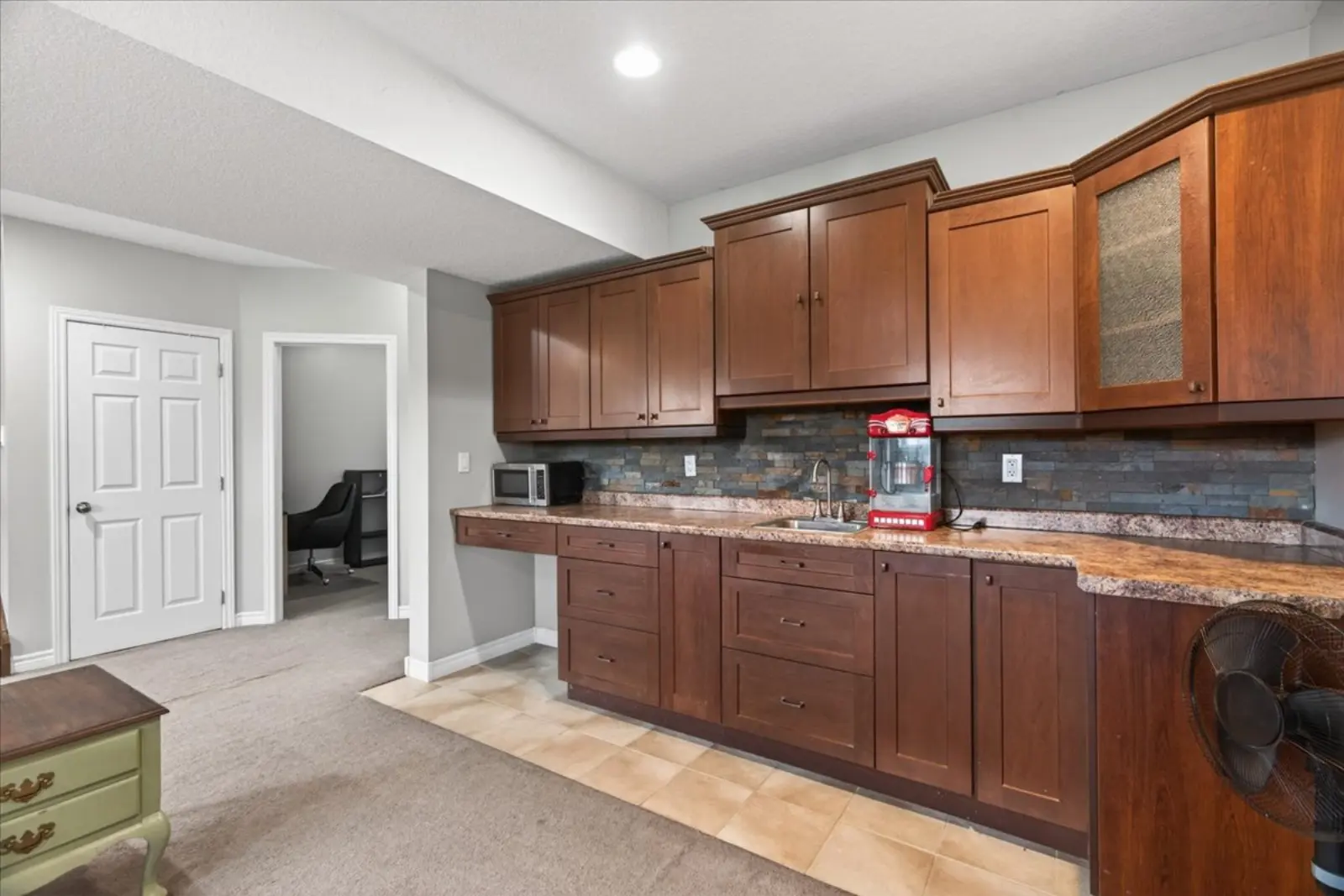 Built-in wet bar in the rec room