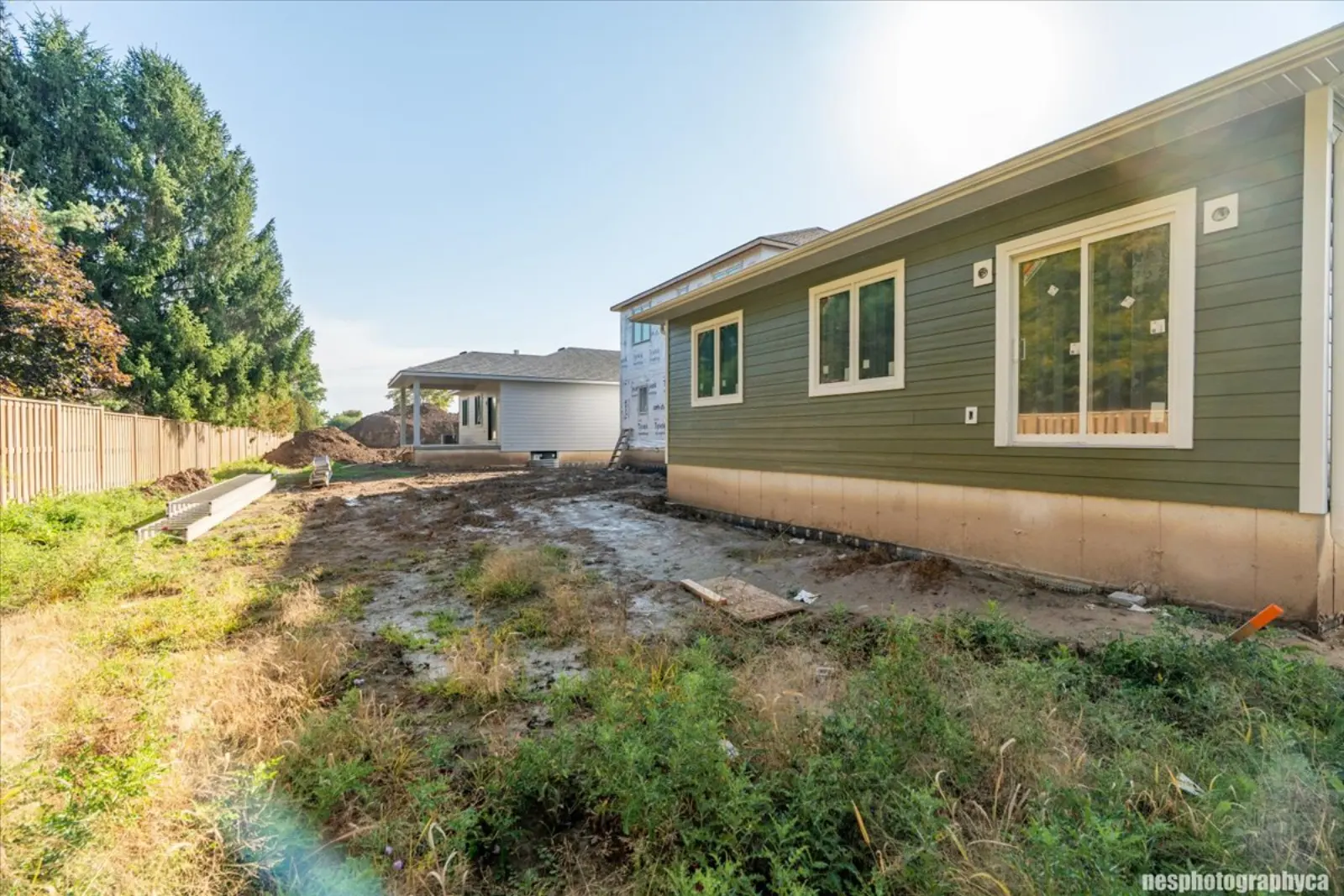 Side of the home and the graded yard