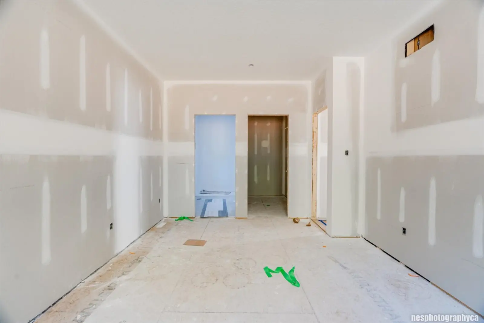 Room looking toward a closet and doorway