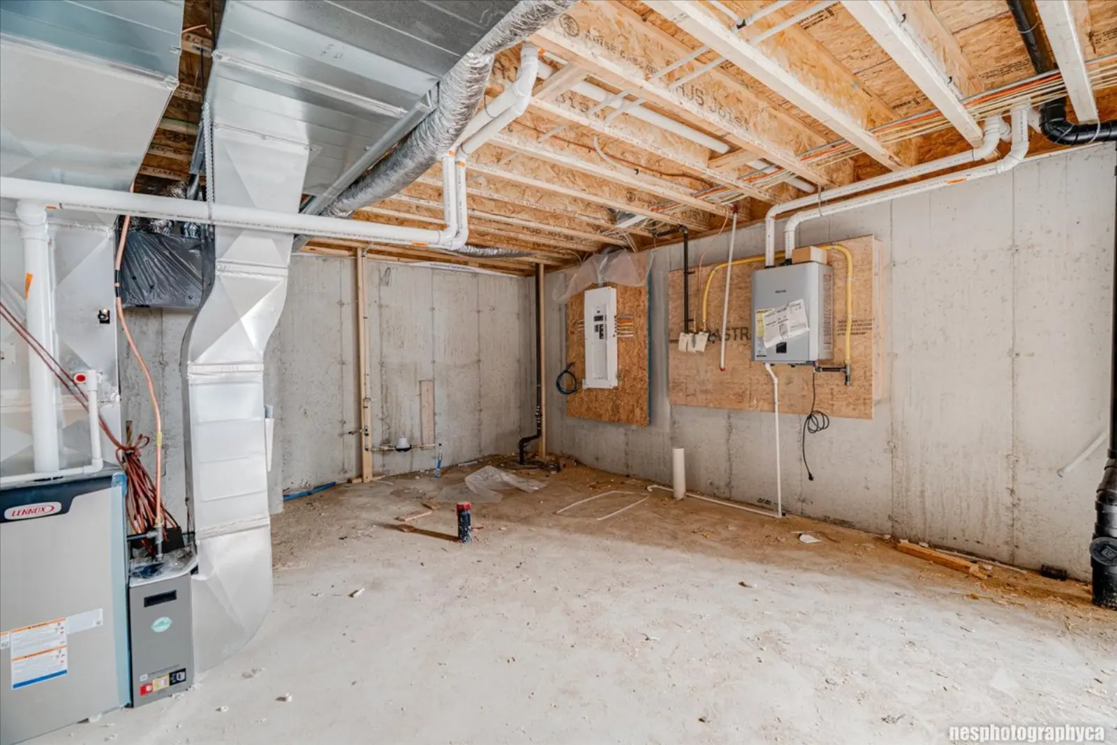 Unfinished basement with the mechanical area