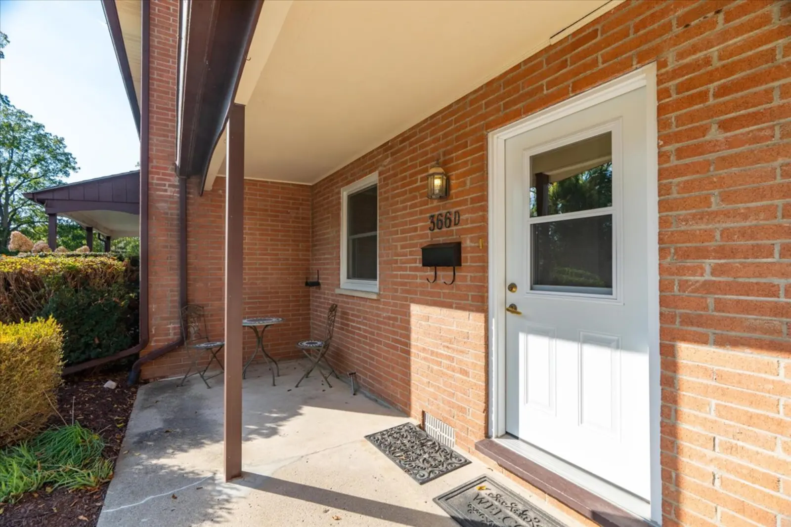 Front door under a covered porch