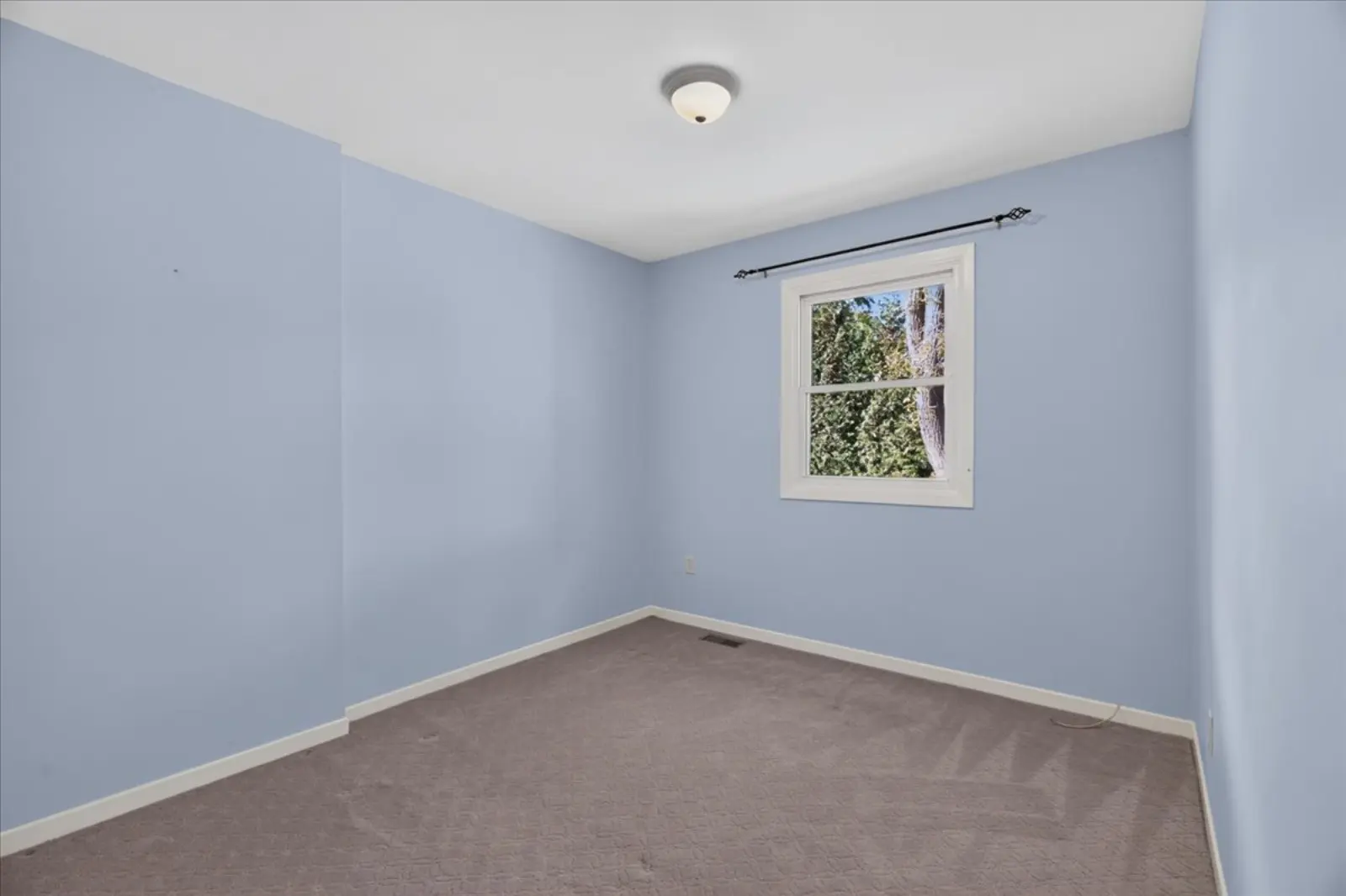 Bedroom with light blue walls