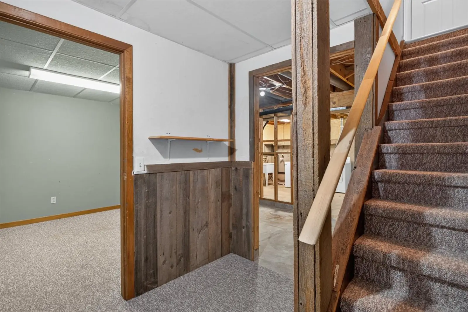 Basement room with wood-panelled walls