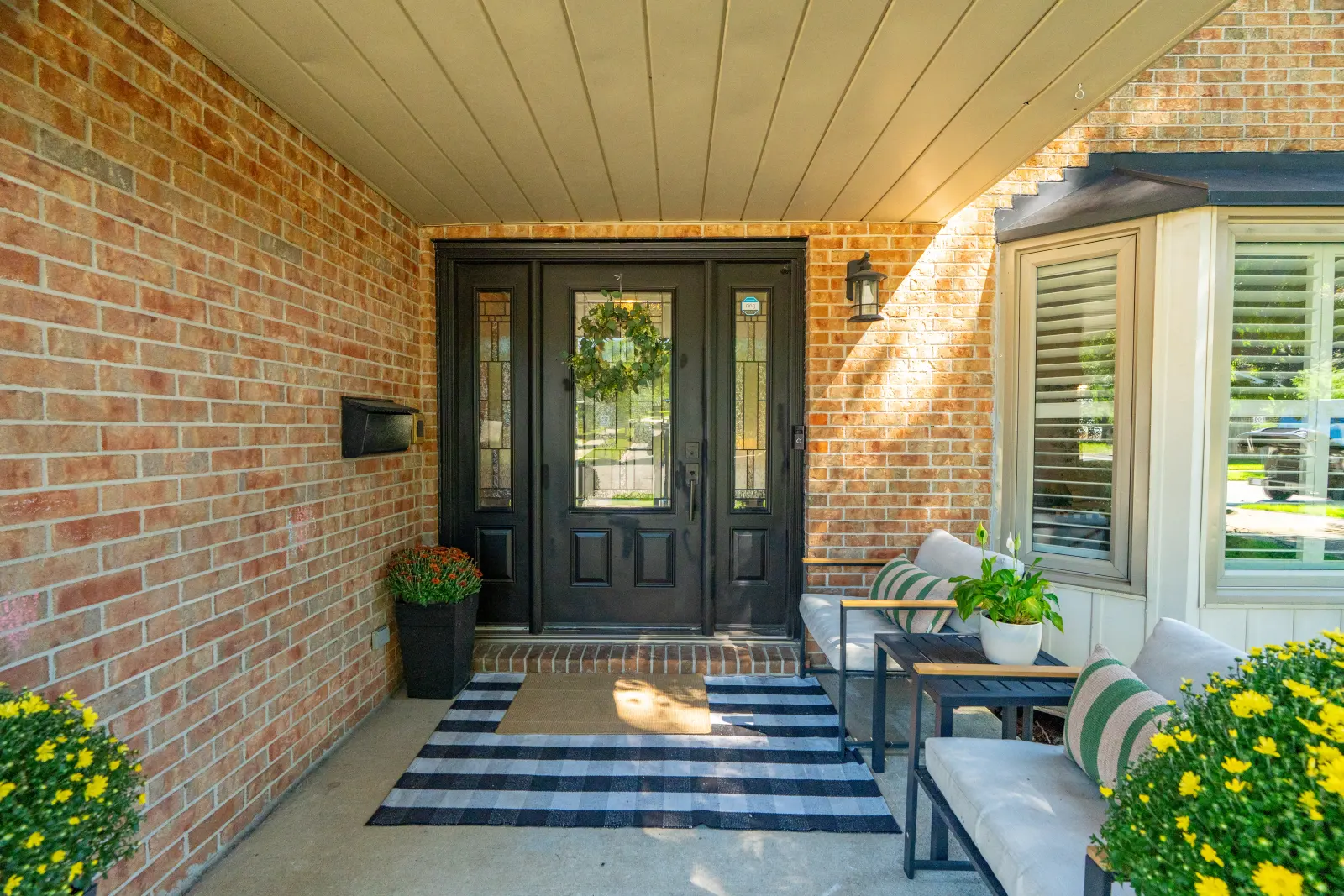 Covered front porch and double front doors