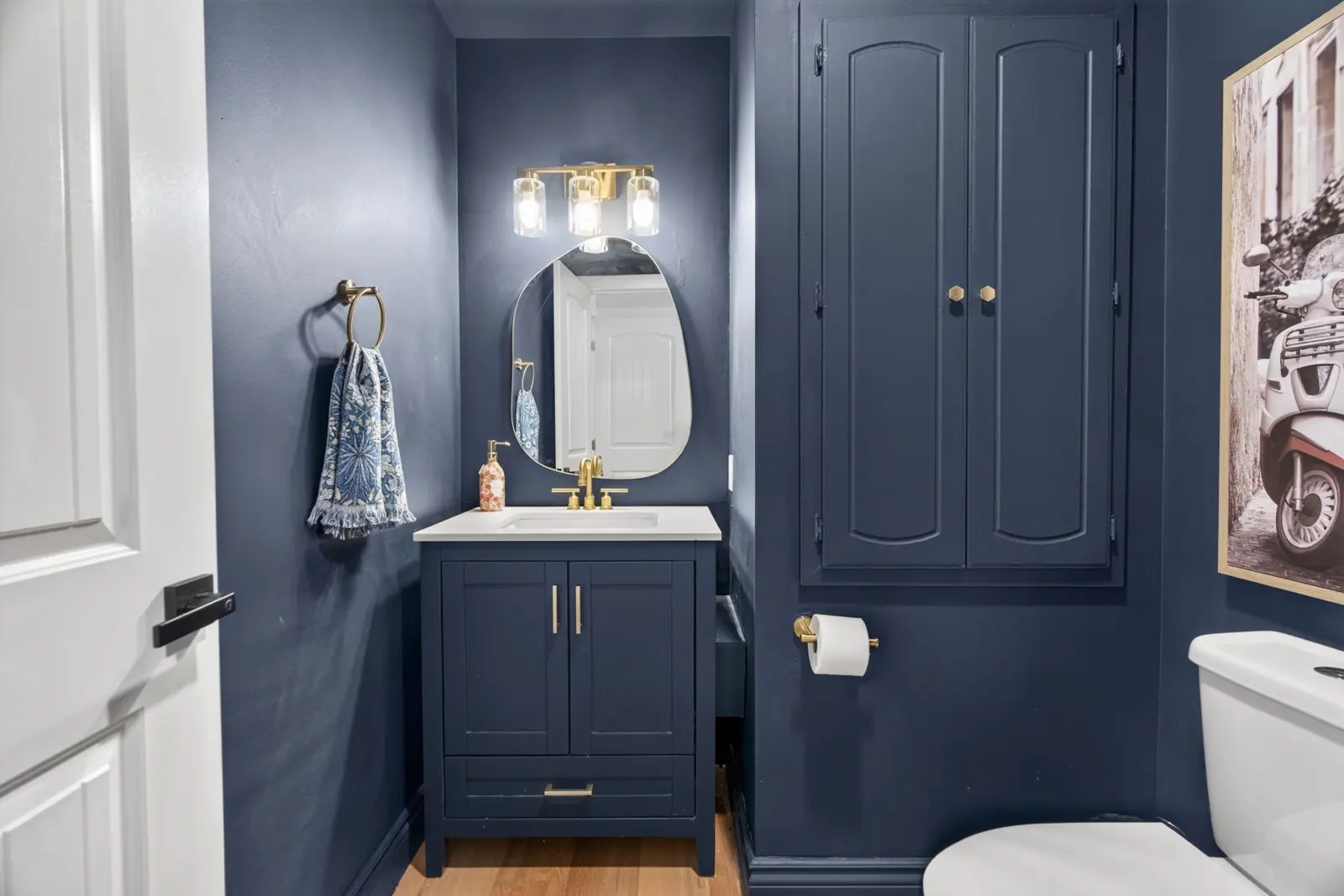 Main-floor bathroom with a navy vanity