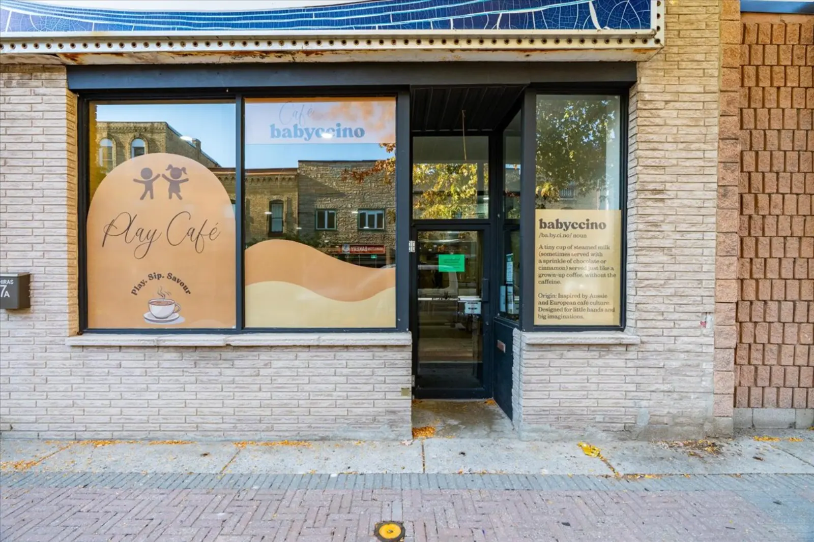 Storefront on Front Street West with large windows and a glass door