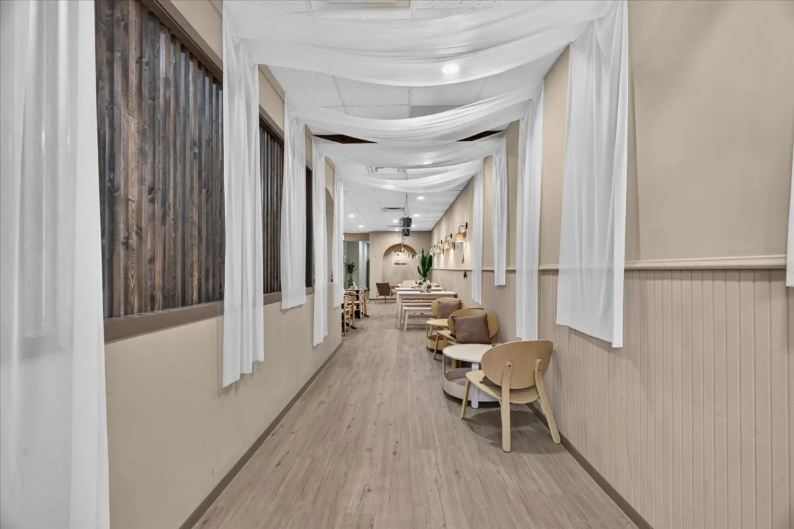 Front entry with sheer drapes and seating