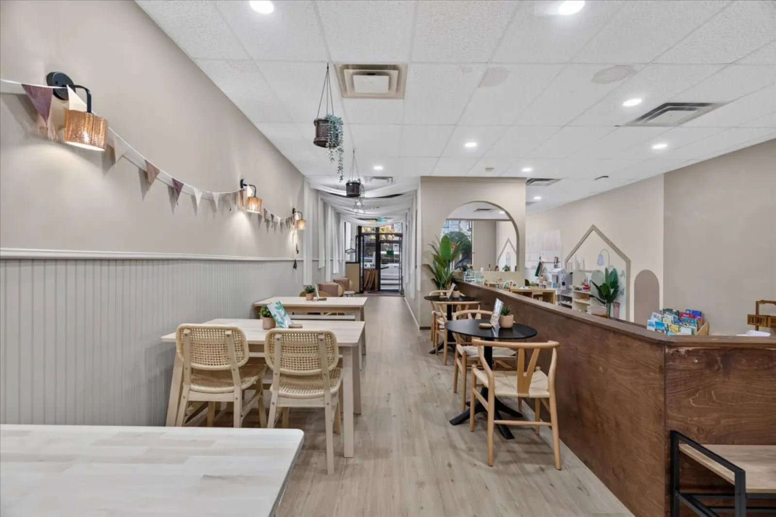 Long view of the café with bench seating and the counter