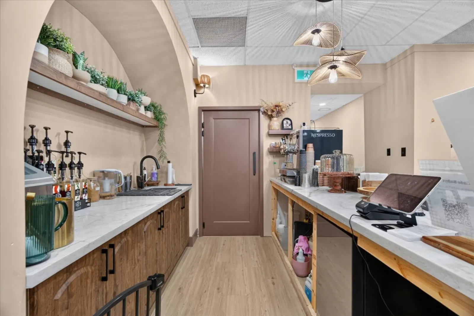 Behind the counter: coffee station and sink