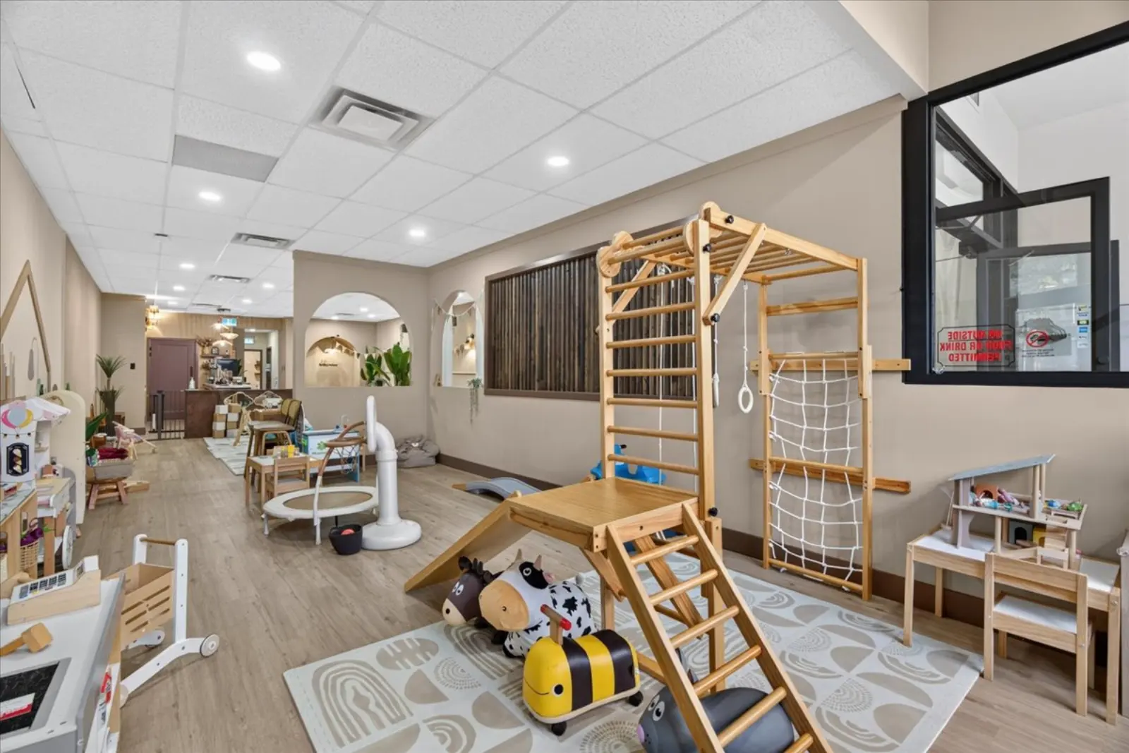 Play area with climbing frame and seating