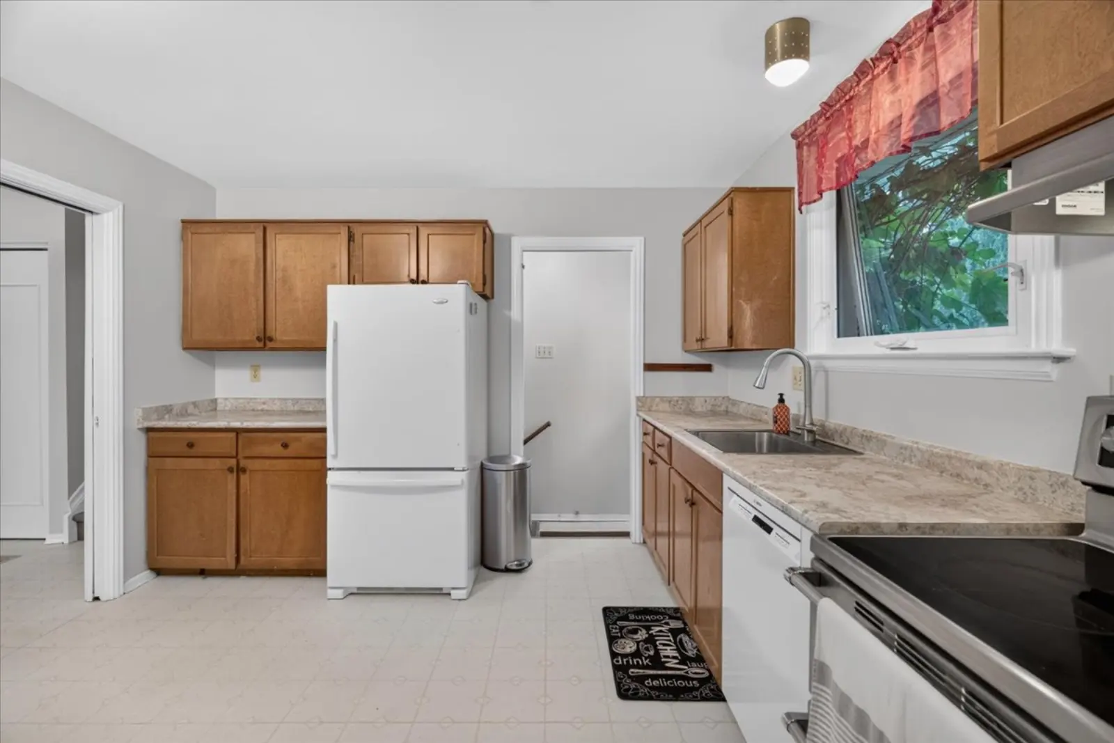 Kitchen with wood cabinets