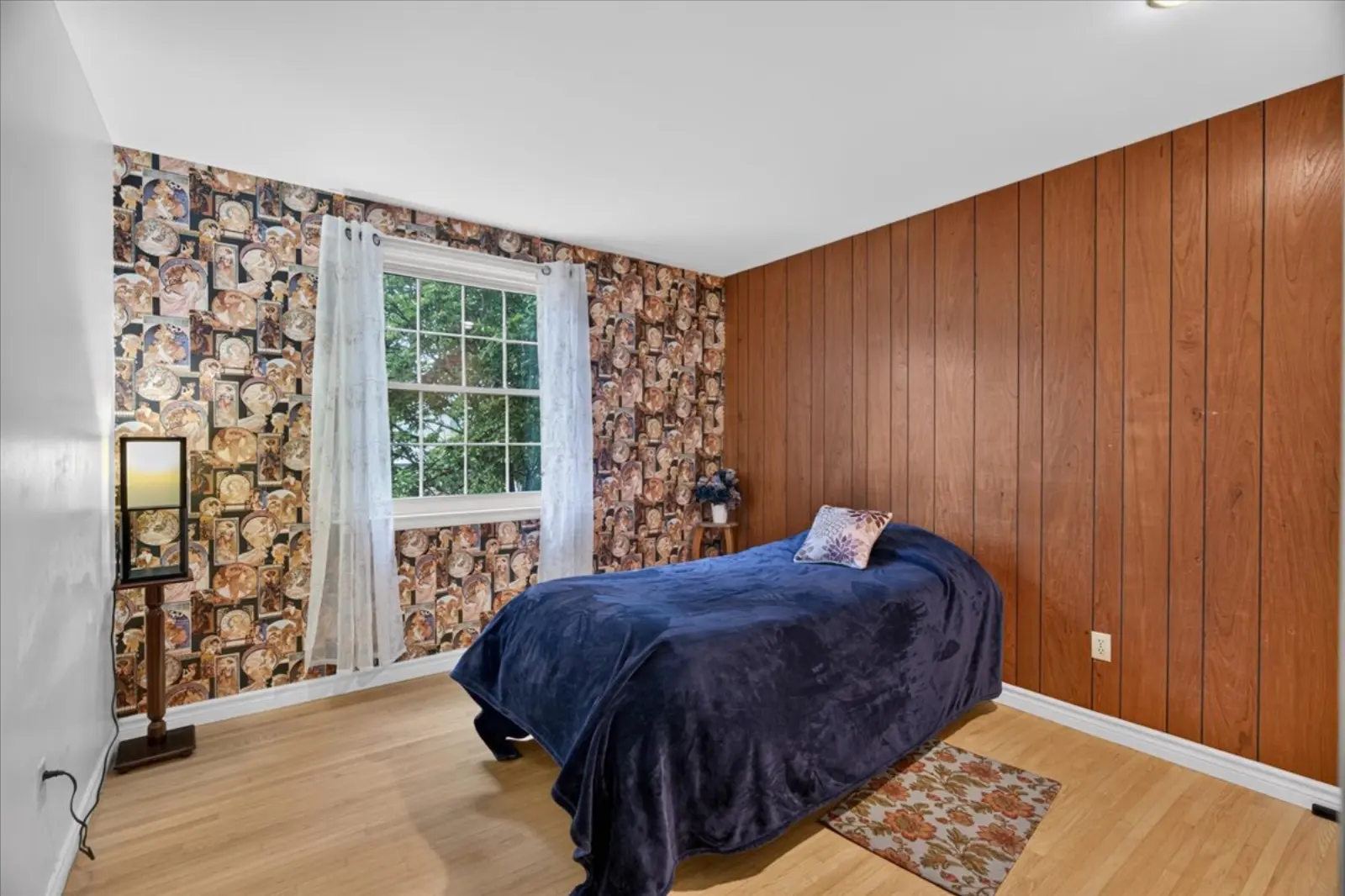 Bedroom with wood panelling