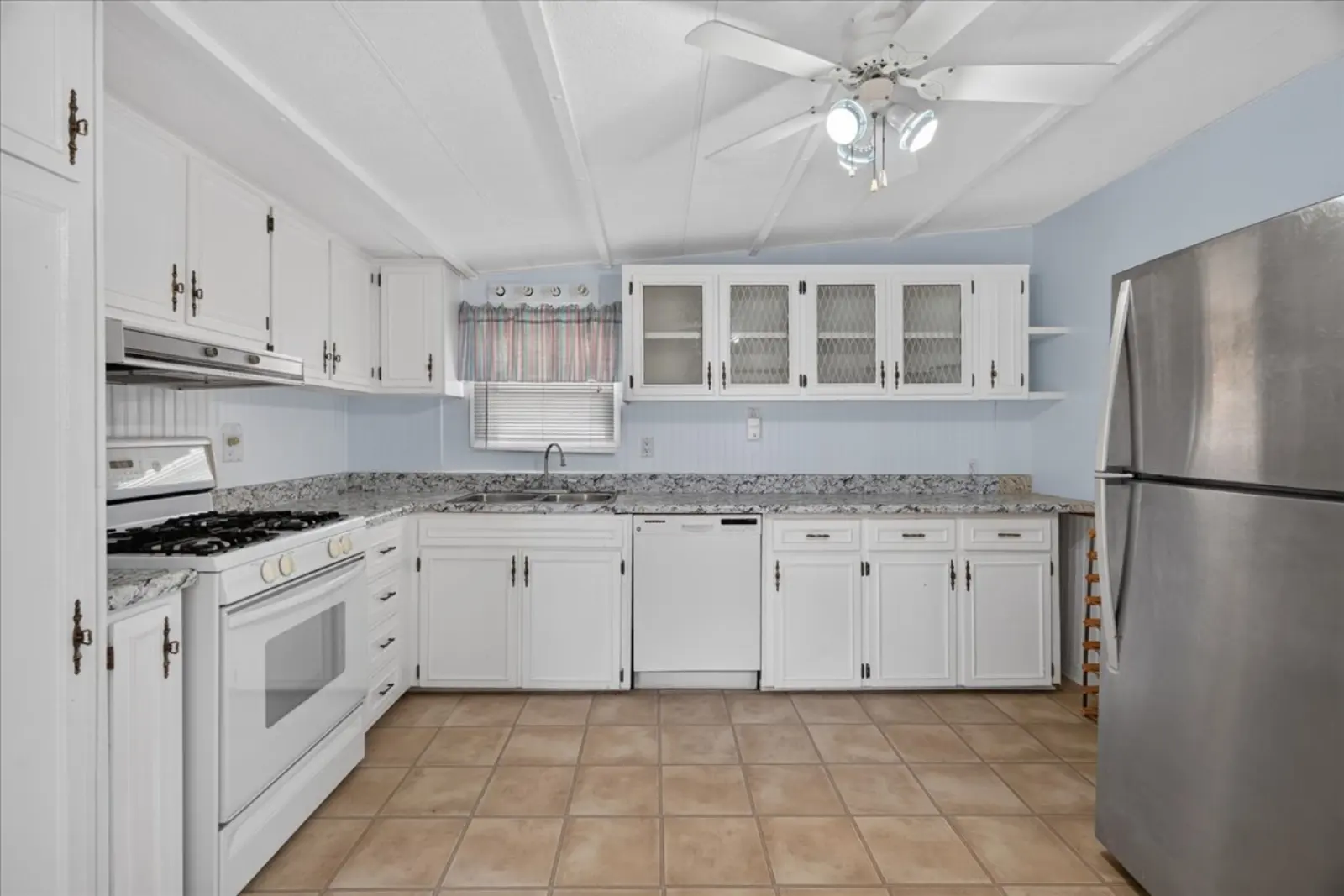 Kitchen with white cabinets and a gas stove
