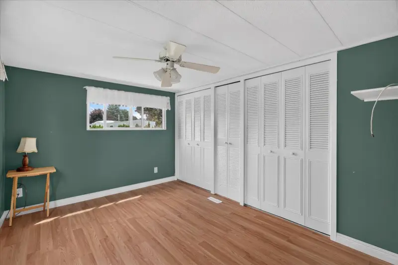 Bedroom with a full wall of closets
