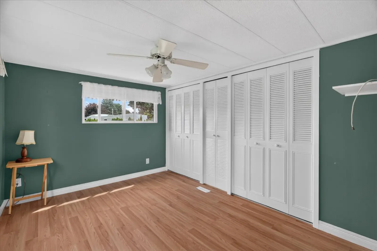 Bedroom with a full wall of closets