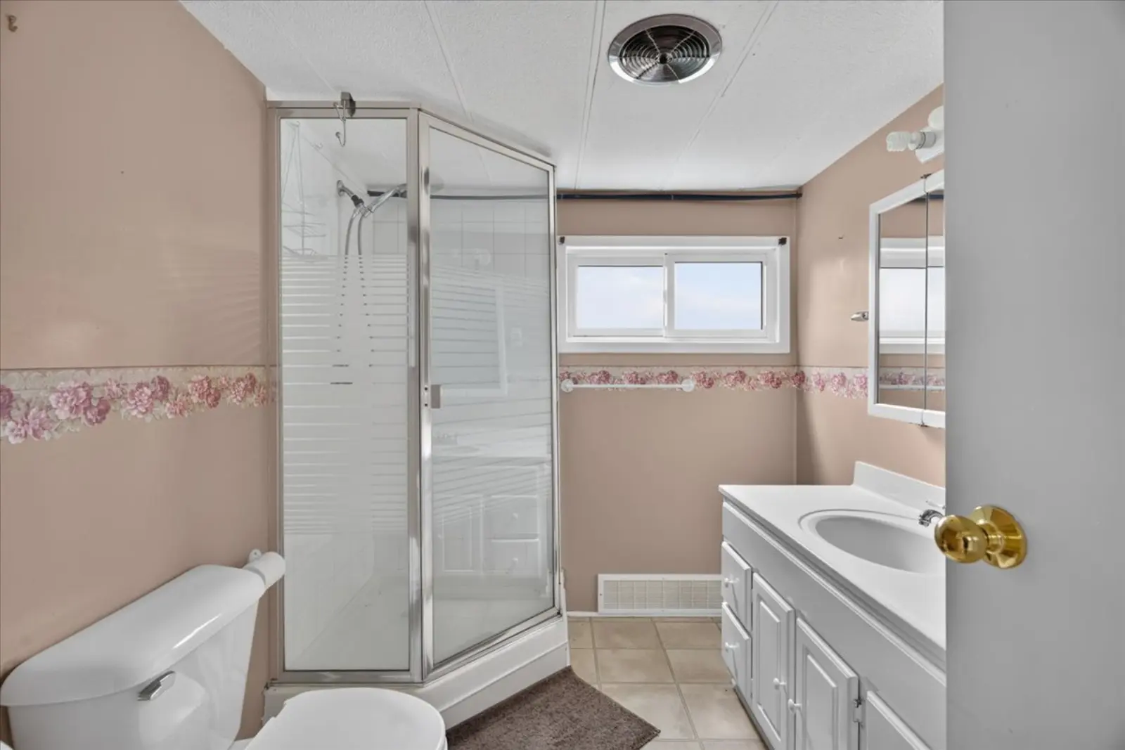 Bathroom with a corner shower