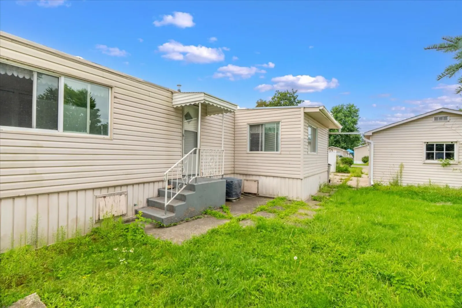 Side of the home and lawn