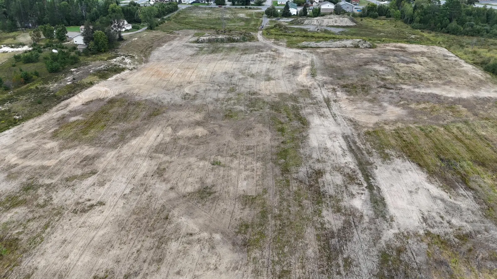 The land from above with houses at its edge